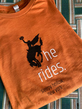 Orange headless horseman sleepy hollow tshirt folded to display design