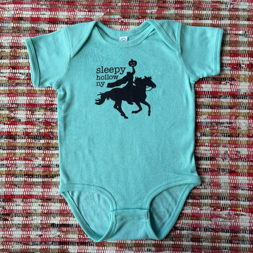 Light blue baby onesie with black graphic of Headless Horseman and text that reads 
